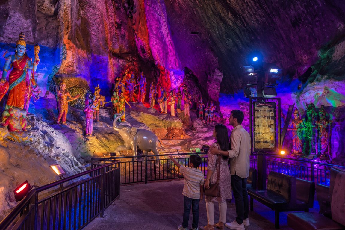 Family exploring the colorful caves and Hindu statues at Batu Caves during a guided cultural tour with Batu Caves Tours in Malaysia
