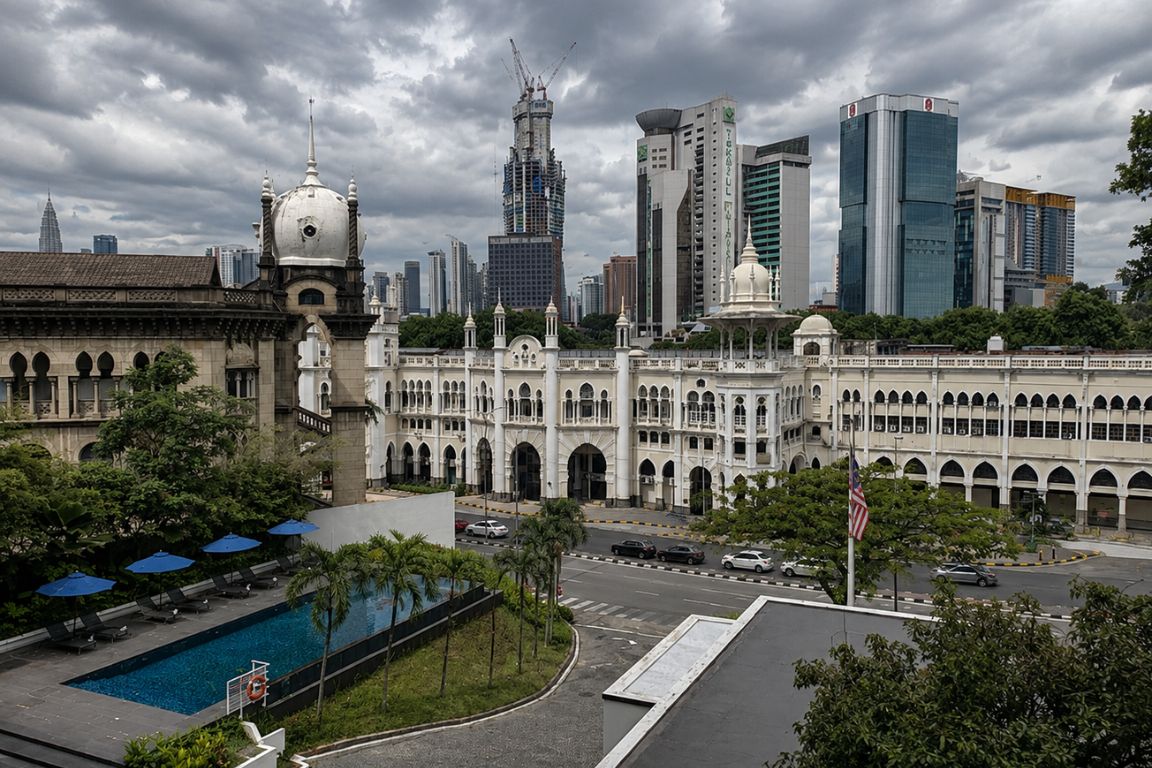 View of Kuala Lumpur Sentral Railway Station with Kuala Lumpur skyline and dramatic clouds during a guided tour with Batu Caves Tours